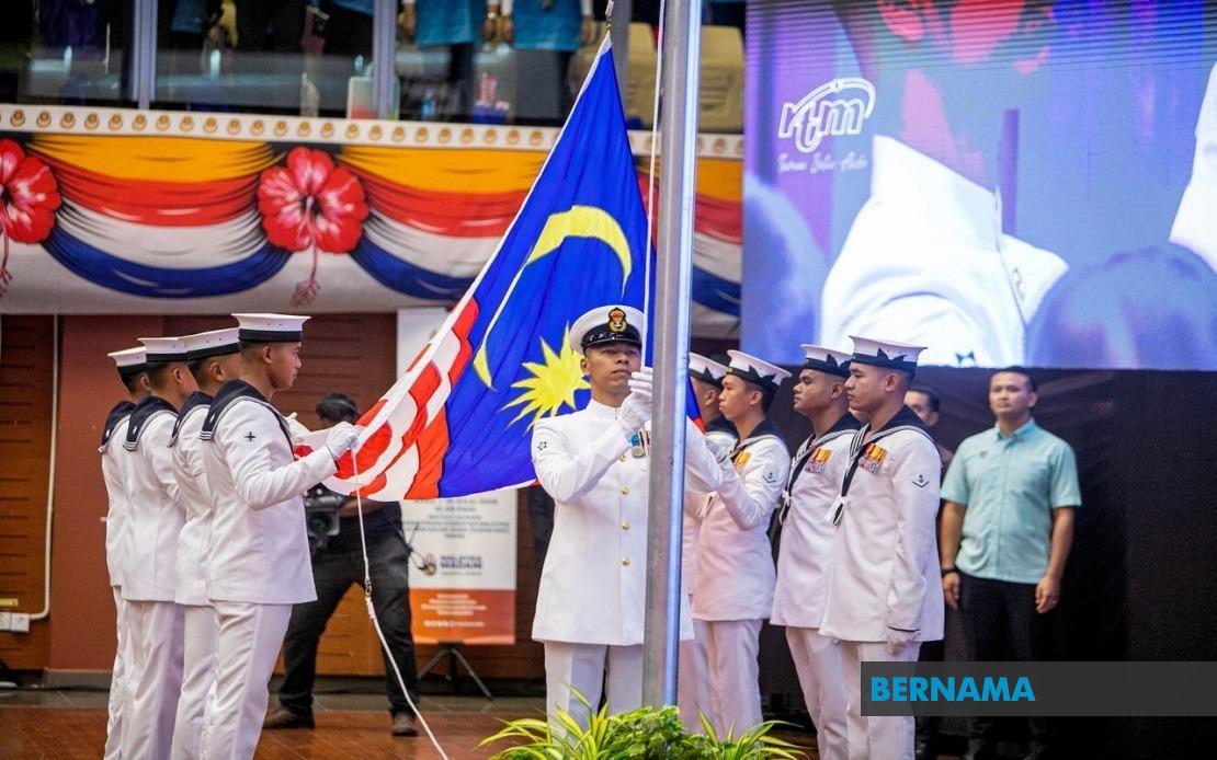 Flag-Raising Ceremony Marks Return of National Month Campaign After Two-Year Break