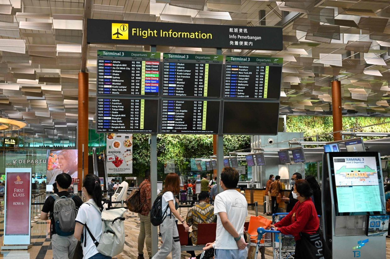 Singapore jails Hong Kong mother and son for airport violence involving police officer